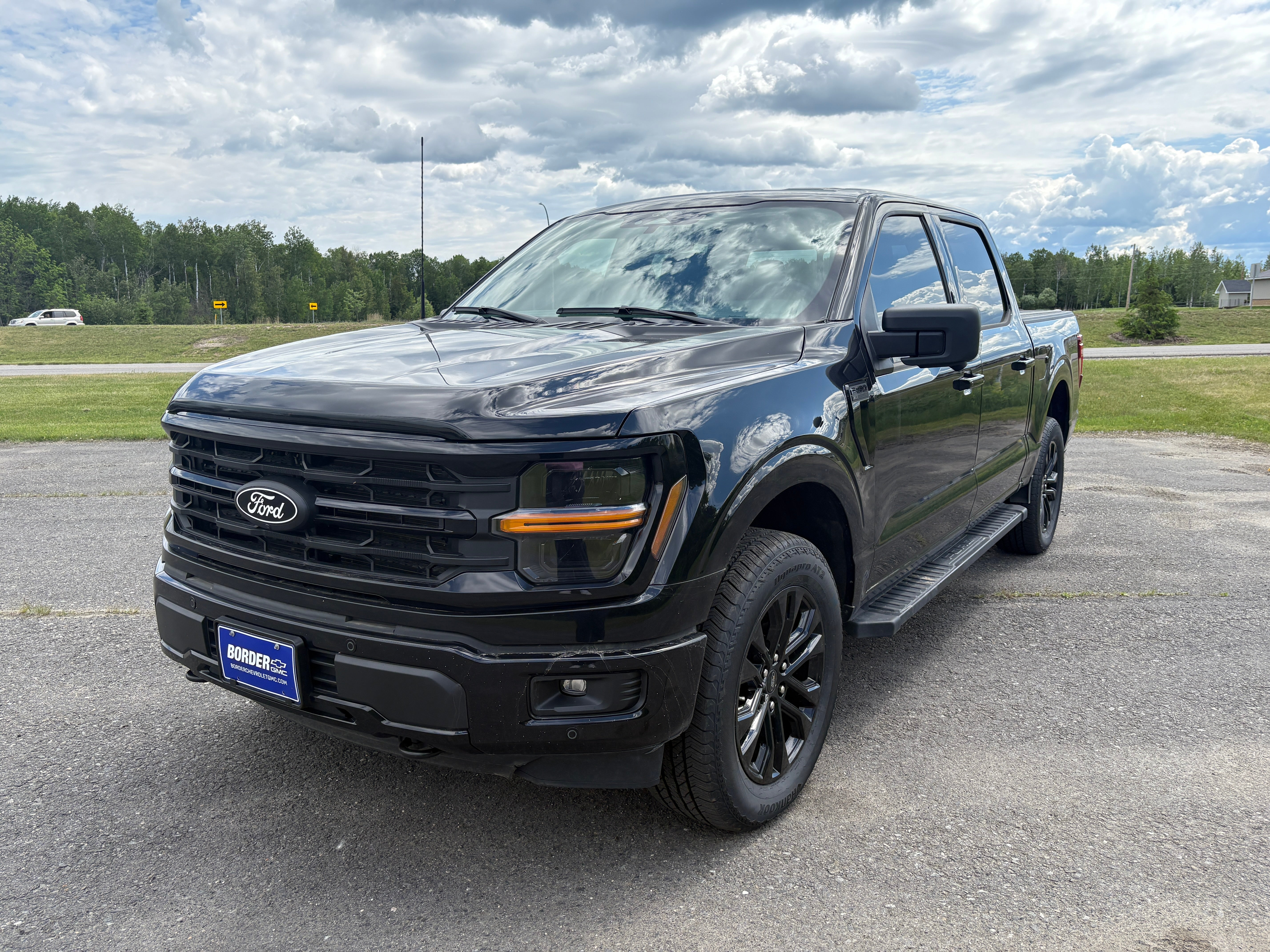 2024 Ford F-150 XLT in Black — front three-quarter view