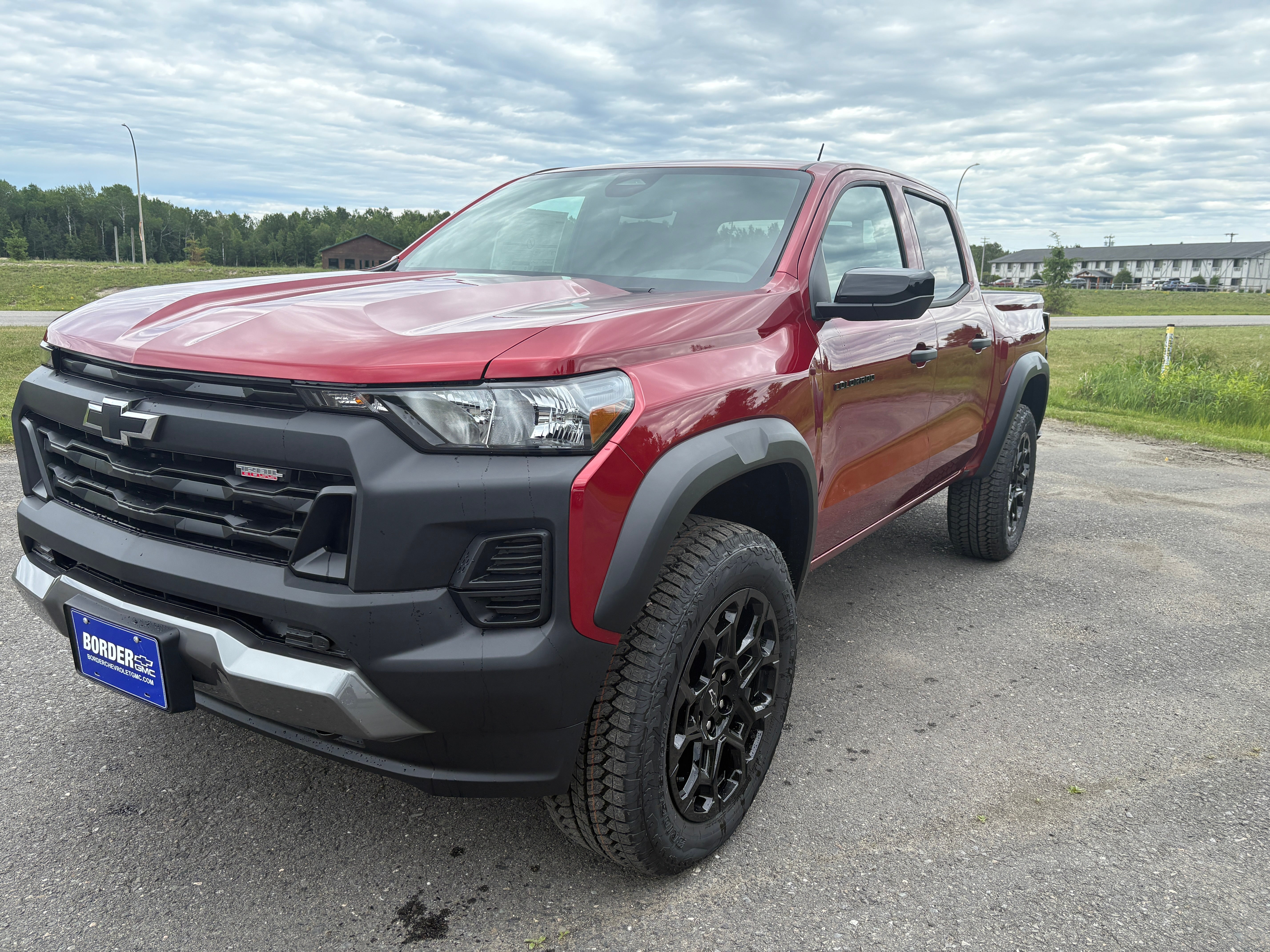 2026 Chevrolet Colorado Trail Boss in Radiant Red Tintcoat — front three-quarter view