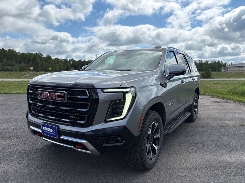 2025 GMC Yukon AT4 in Sterling Metallic — front three-quarter view