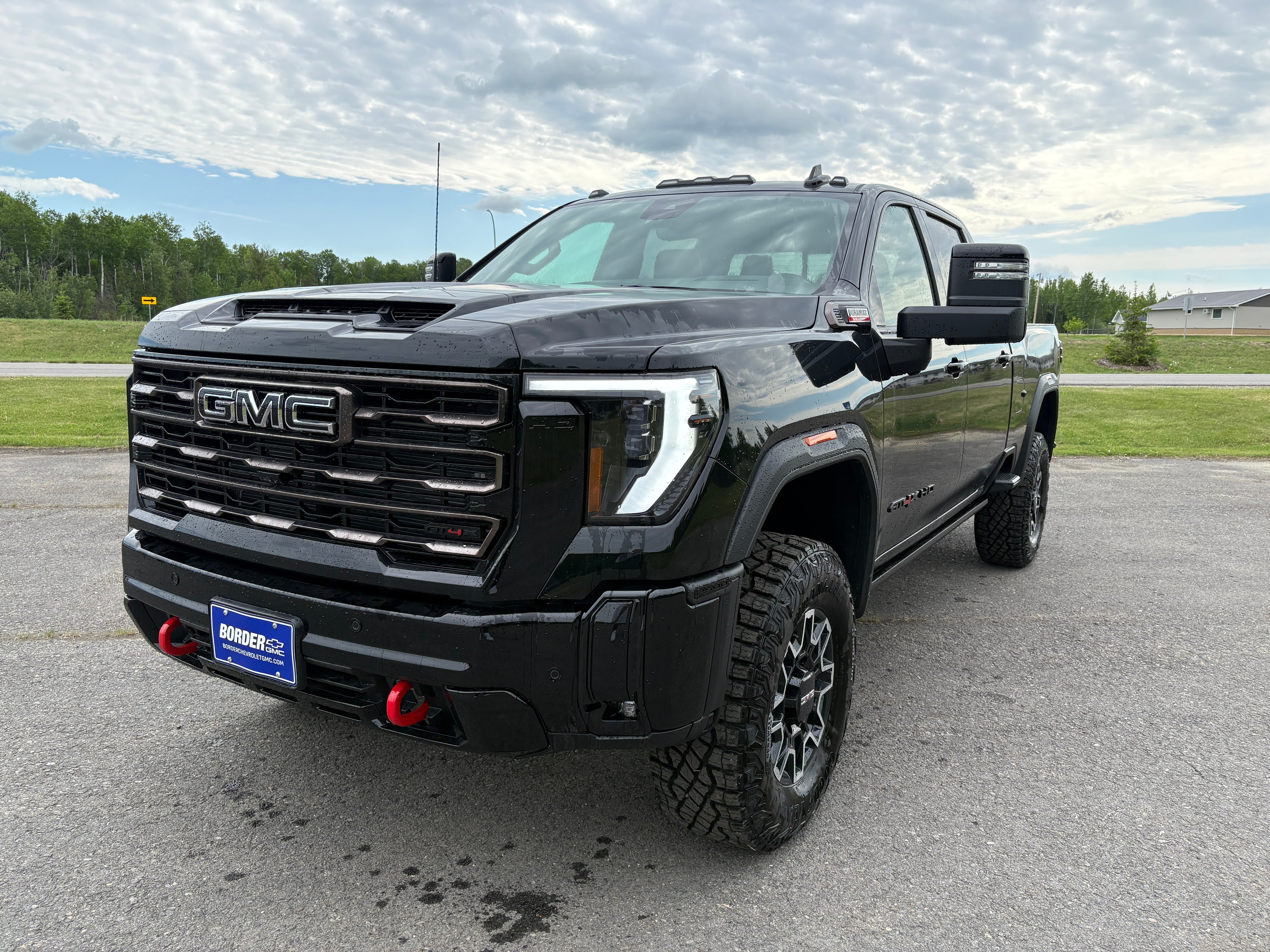 2026 GMC Sierra 2500 HD AT4X in Onyx Black — front three-quarter view
